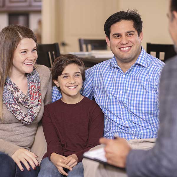 Family counseling session at home with agent